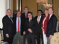 From left to right: Mayor Albert Huntington; Dr. Ahmet Gultekin, President-elect of the Tristate Turkish American Association in Cincinnati, Ohio; Dr. Justin McCarthy, Ottoman Scholar at the University of Louisville in Louisville, Kentucky; Alp Berker, Regional Vice President of ATAA in Indianapolis, Indiana; the Honorable Kenan Ipek, the Turkish Consul General in Chicago, Illinois; Dr. Sue DeWine, President of Hanover College; and G. Lincoln McCurdy, President of TCA. Participating in the ceremony but not pictured are Talha Uzun, President of the American Turkish Association in Indianapolis ; Daniele Berker and Uzay Kirbiyik of Indianapolis ; and Beth McCarthy of Louisville.