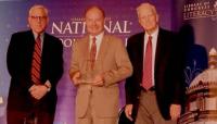 TCA President G. Lincoln McCurdy (center), representing ACEV, receives the 2014 International Prize from David M. Rubenstein (left), Co-Chair of the Book Festival, and Librarian of Congress James H. Billington (right).